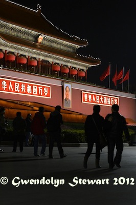 People Walk by the Tiananmen Portrait of Mao Zedong at Night, 
Photographed by Gwendolyn Stewart c. 2013; All Rights Reserved